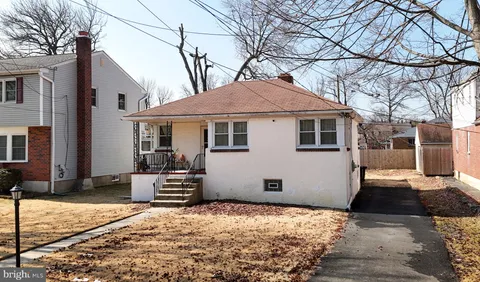 a house with trees in the background