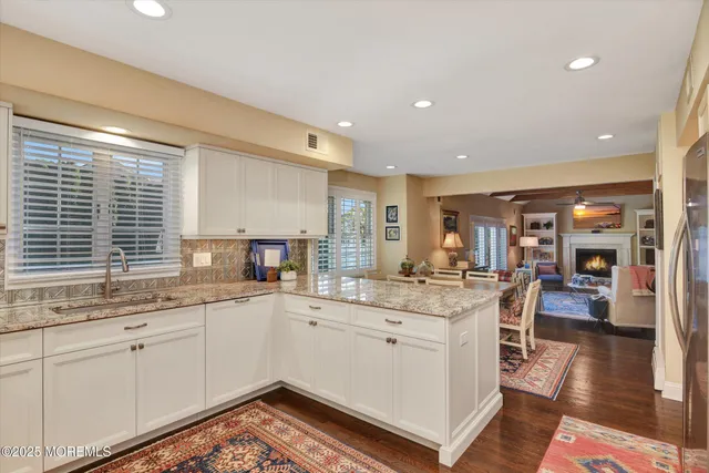 a kitchen with a sink stove and wooden cabinets