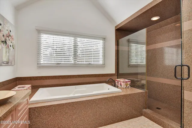 a bathroom with a bathtub and a shower