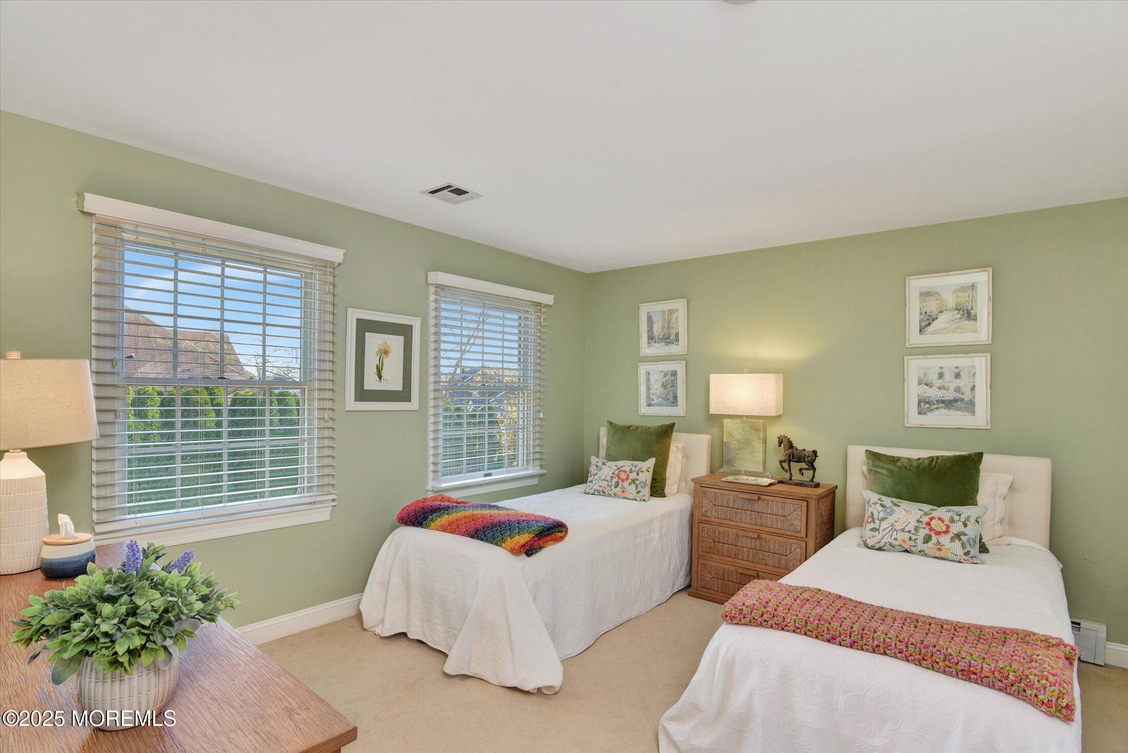 14 Lebanon Drive Brielle, NJ 08730 - Photo 28 of 42 a bedroom with two beds and a large window