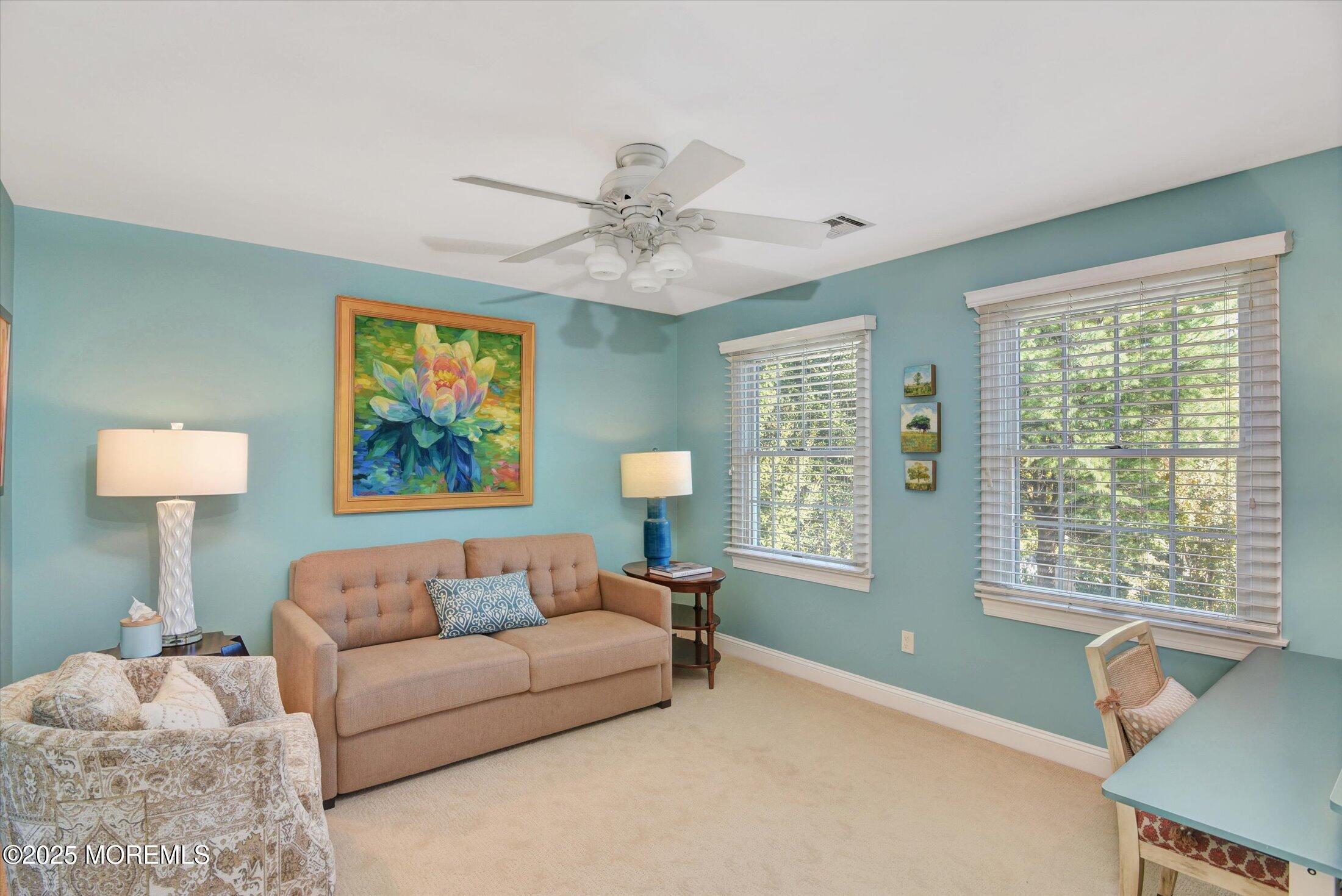 14 Lebanon Drive Brielle, NJ 08730 - Photo 29 of 42 a living room with furniture and a lamp