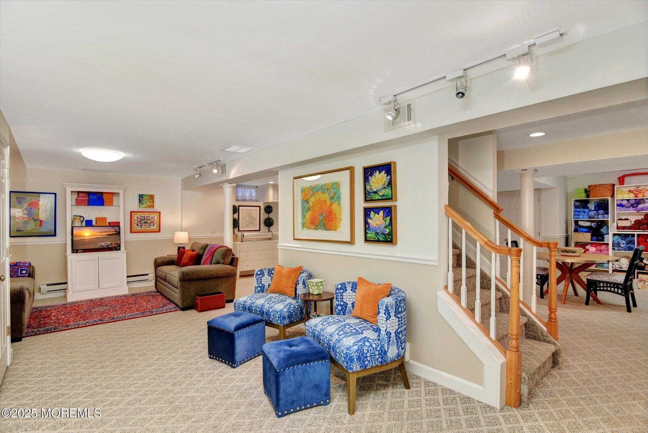 14 Lebanon Drive Brielle, NJ 08730 - Photo 33 of 42 a living room with furniture and a flat screen tv