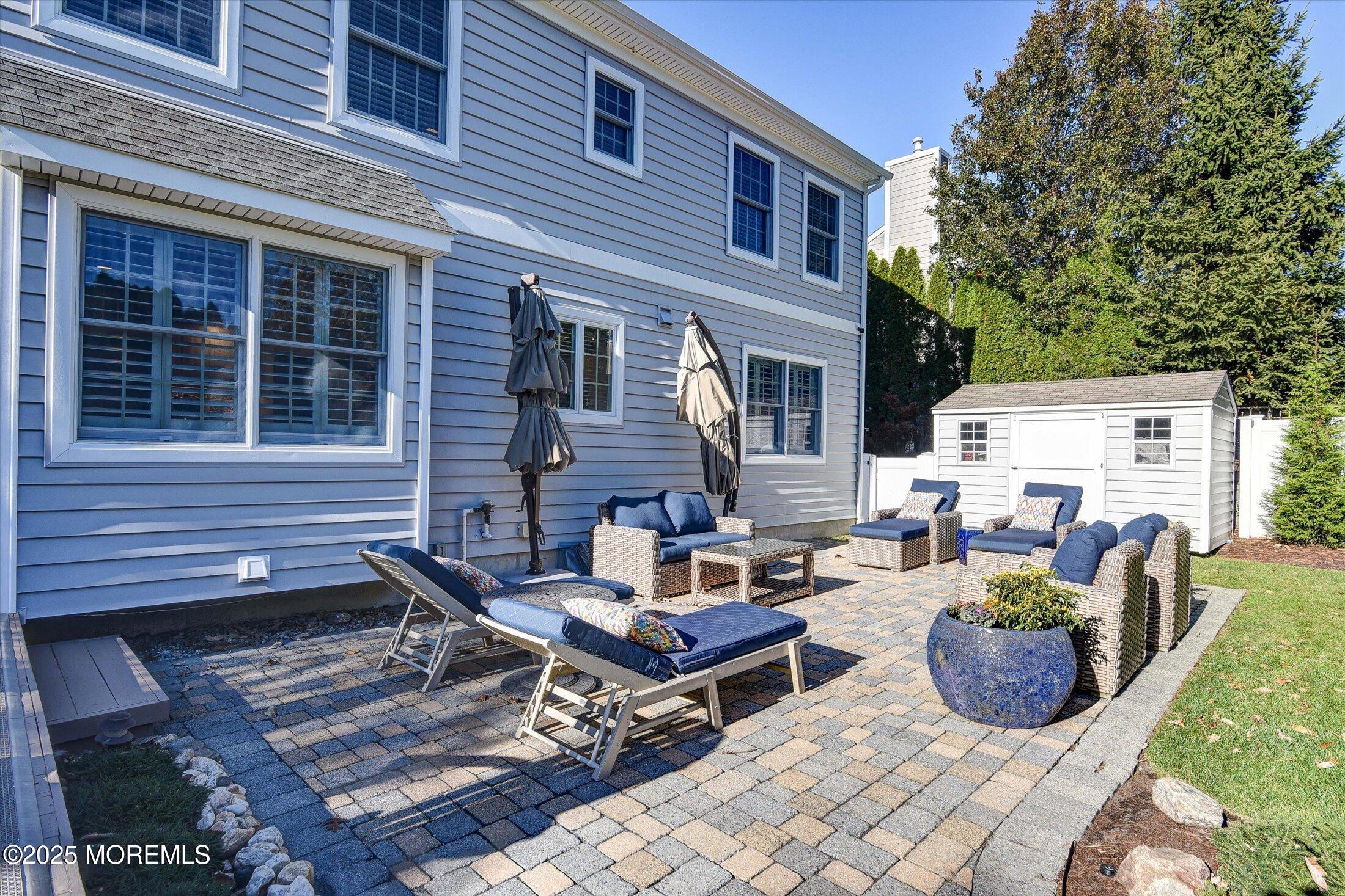 14 Lebanon Drive Brielle, NJ 08730 - Photo 38 of 42 a backyard of a house with seating space