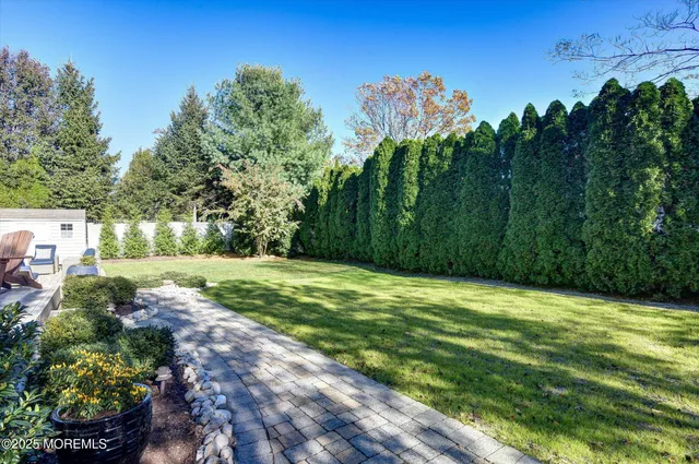 a view of a big yard with lots of green space