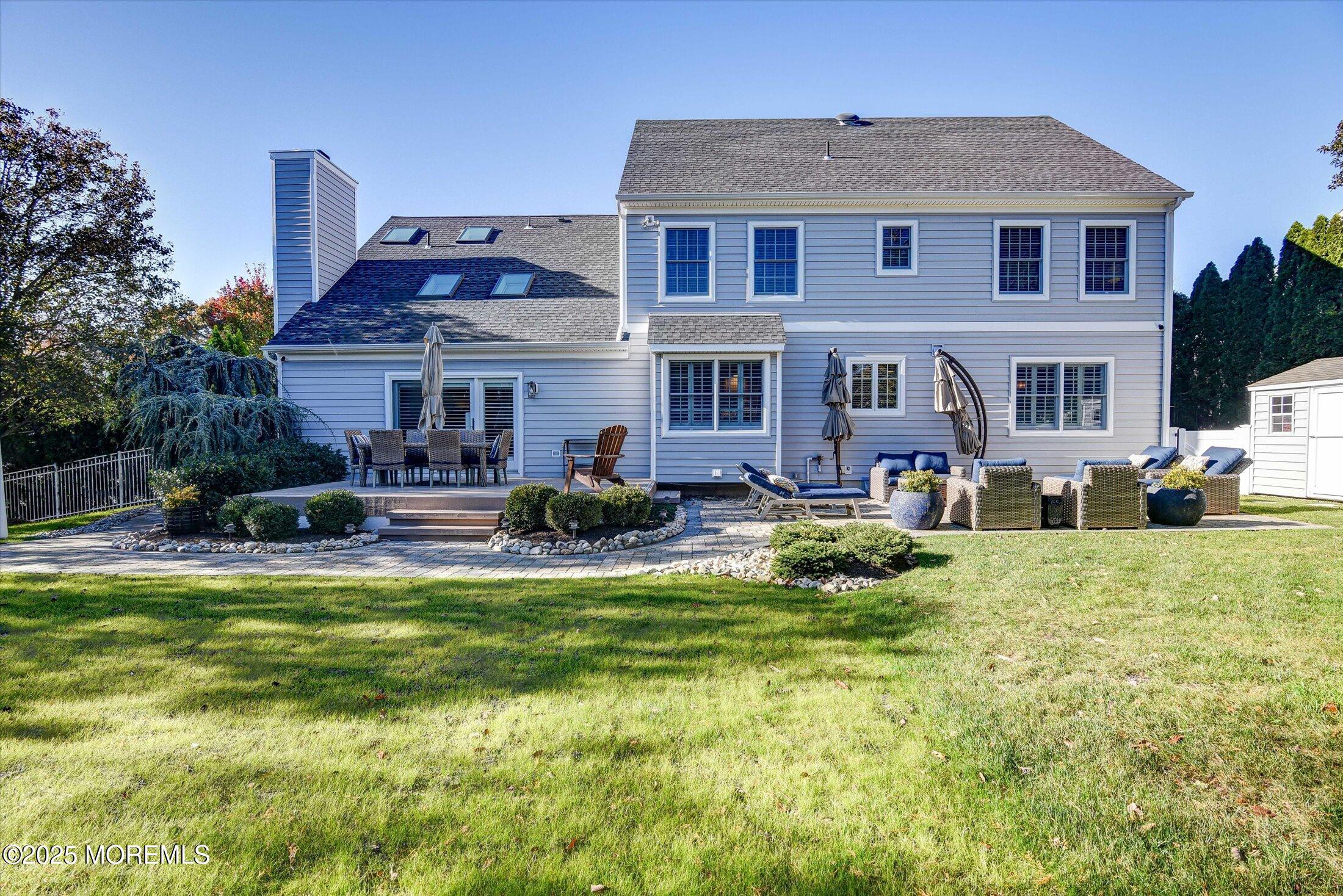 14 Lebanon Drive Brielle, NJ 08730 - Photo 42 of 42 a front view of house with yard and trees in the background