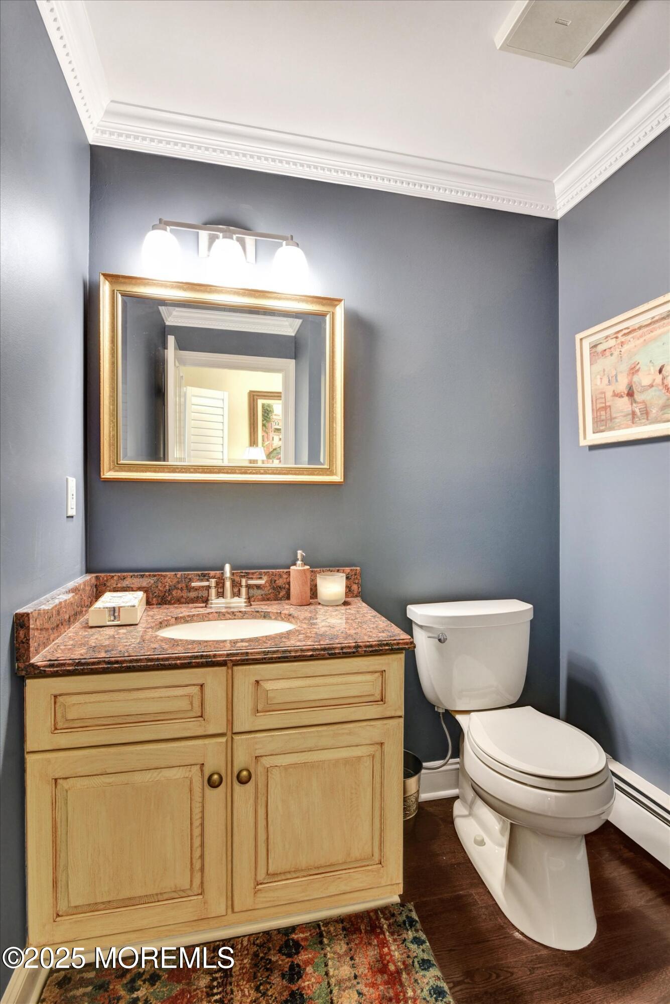 14 Lebanon Drive Brielle, NJ 08730 - Photo 7 of 42 a bathroom with a toilet sink and mirror