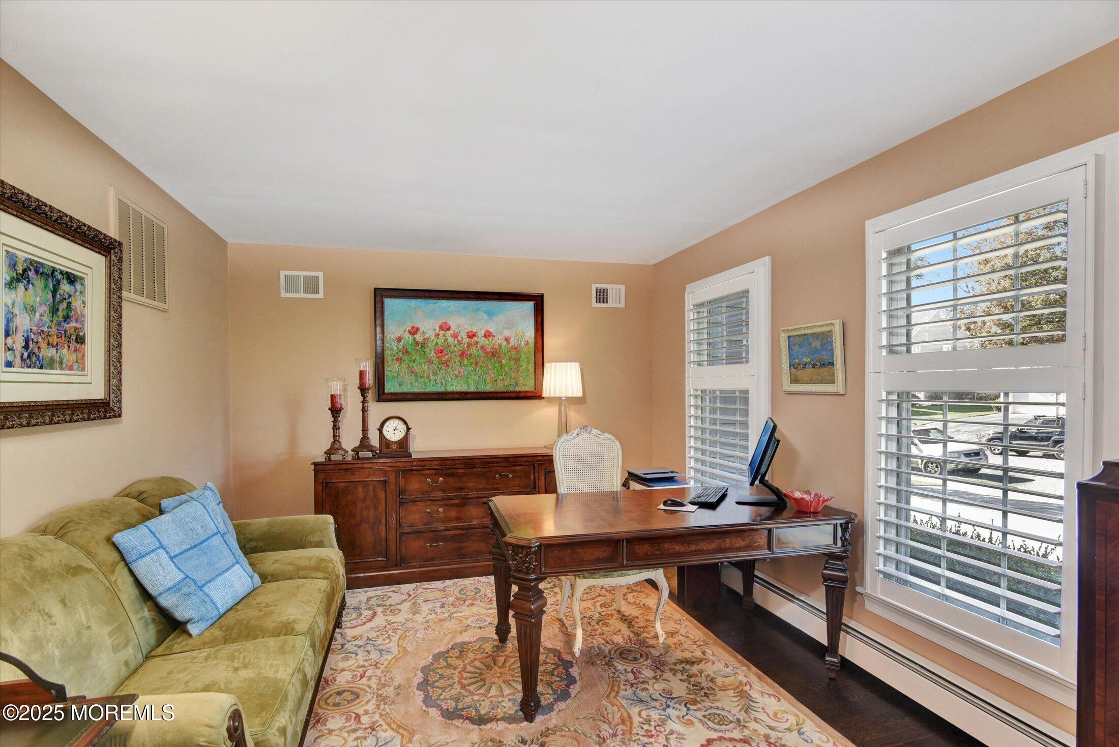 14 Lebanon Drive Brielle, NJ 08730 - Photo 8 of 42 a living room with furniture a rug and a window