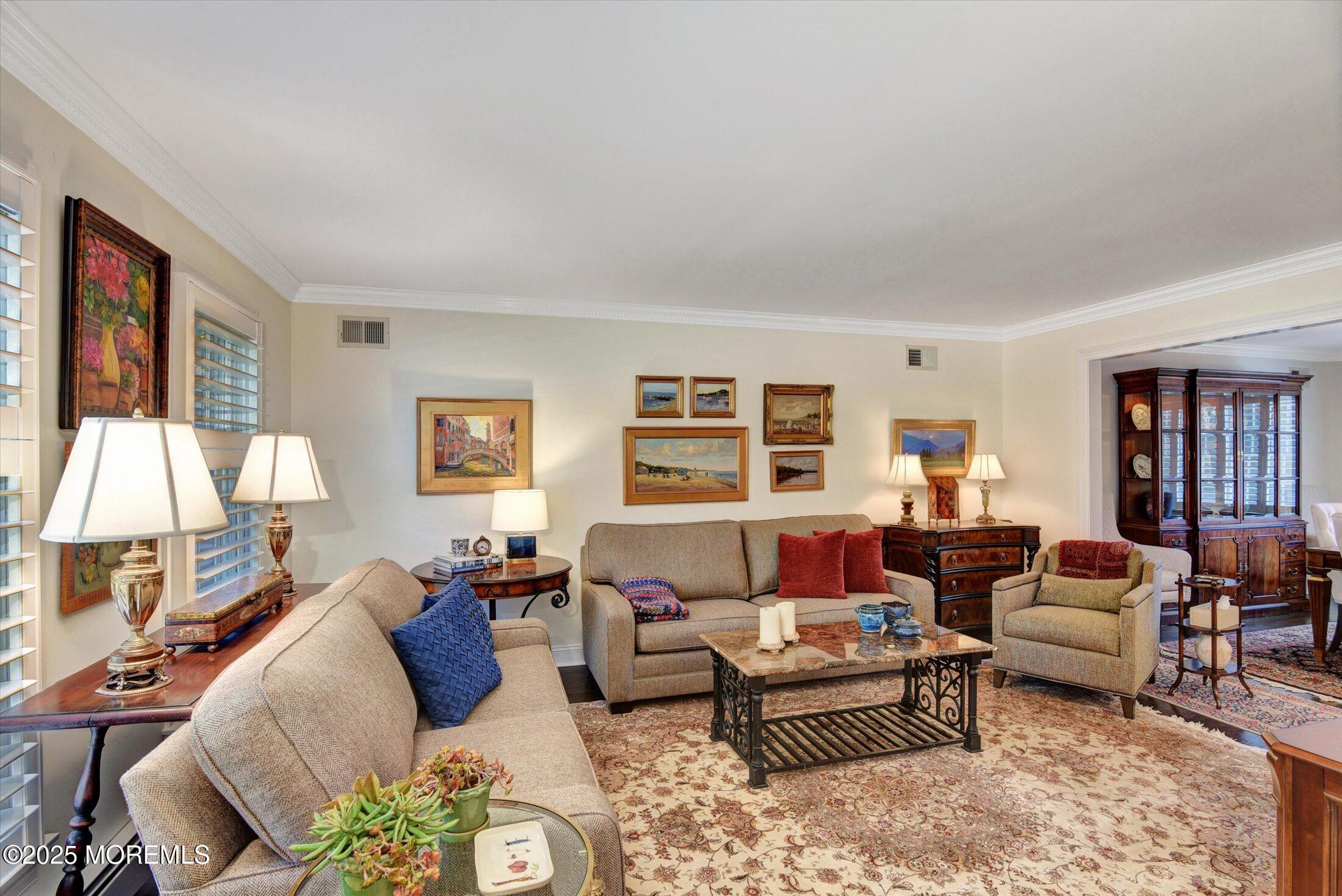 14 Lebanon Drive Brielle, NJ 08730 - Photo 9 of 42 a living room with furniture and a flat screen tv