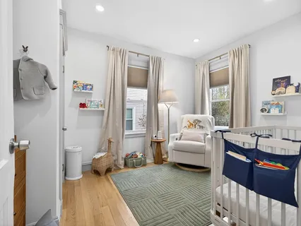a spacious bedroom with a bed and a couch