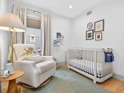 a bedroom with bed and a window