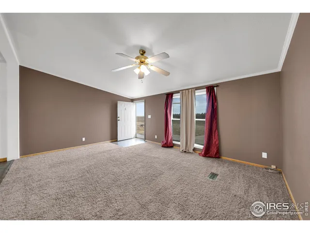 a kitchen with stainless steel appliances kitchen island wooden floors and granite counter tops