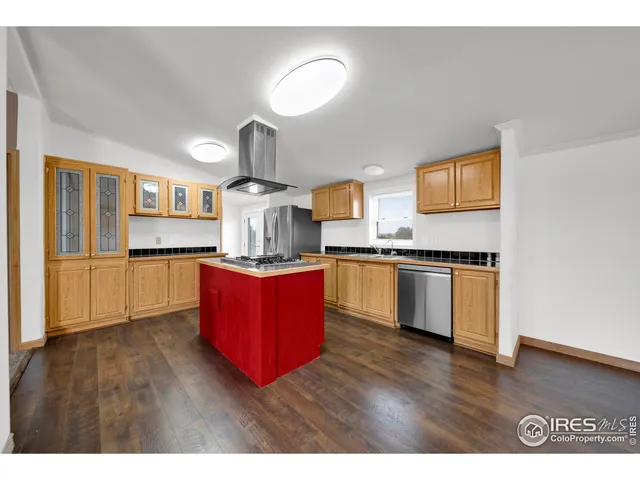 a kitchen with stainless steel appliances granite countertop a stove a sink dishwasher and a refrigerator