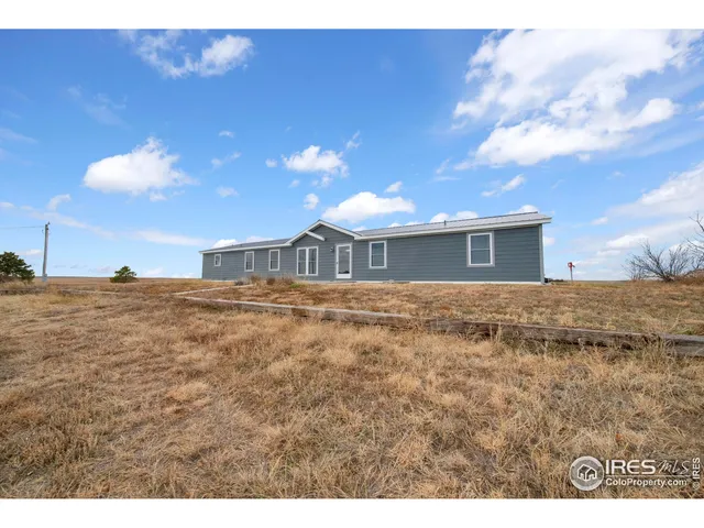 a view of house with yard