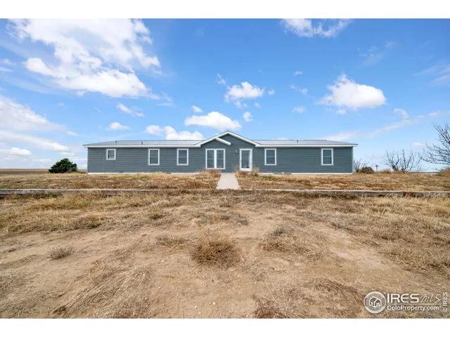 a view of a house with a big yard