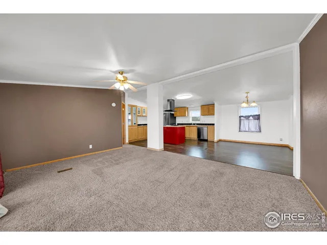 a view of empty room with a ceiling fan