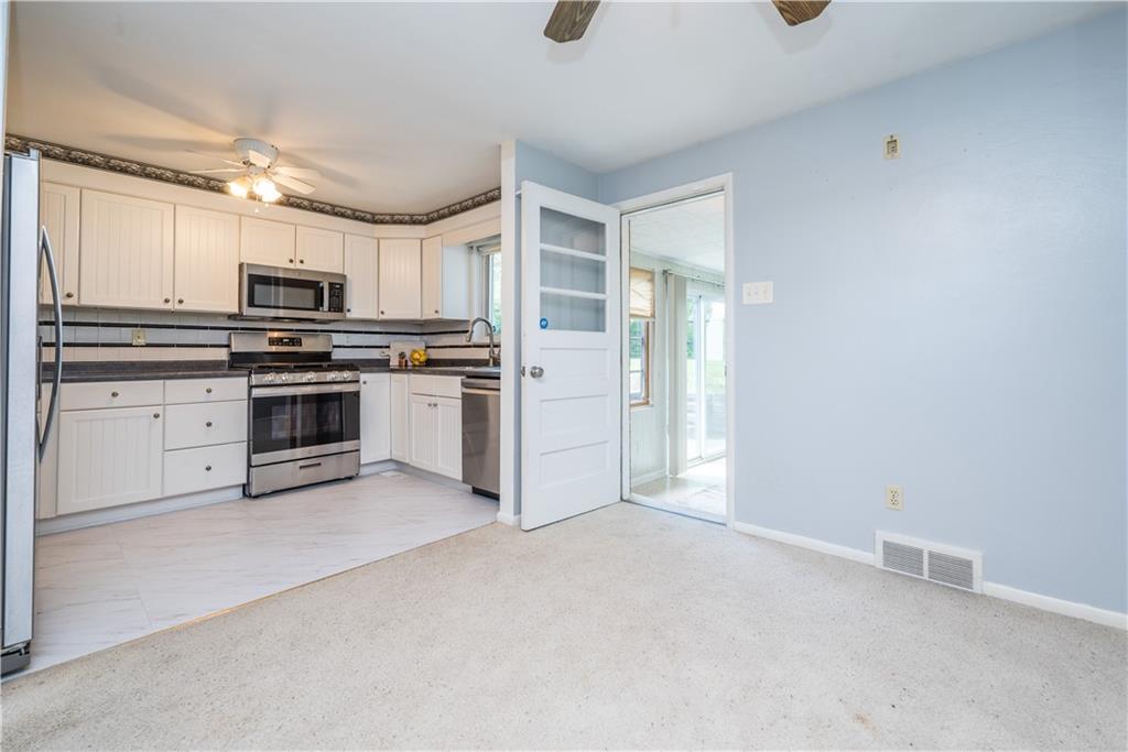 1565 Cathell Road Pittsburgh, PA 15236 - Photo 11 of 27 Kitchen opens to dining room area & sunroom
