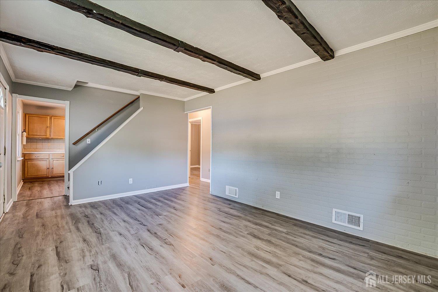 310 Howard Avenue Middlesex, NJ 08846 - Photo 12 of 42 a view of a hallway with wooden floor
