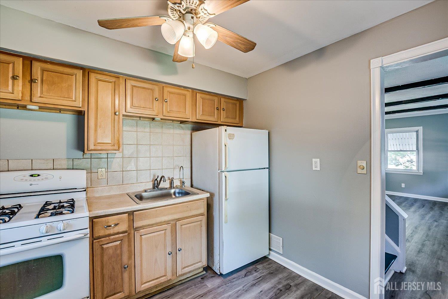 310 Howard Avenue Middlesex, NJ 08846 - Photo 16 of 42 a kitchen with a refrigerator stove and sink