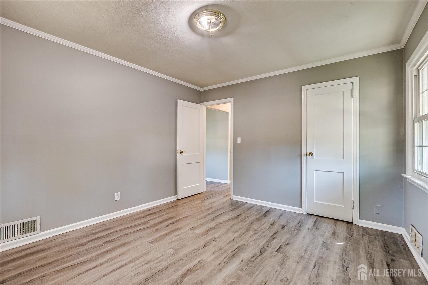 310 Howard Avenue Middlesex, NJ 08846 - Photo 17 of 42 wooden floor in an empty room