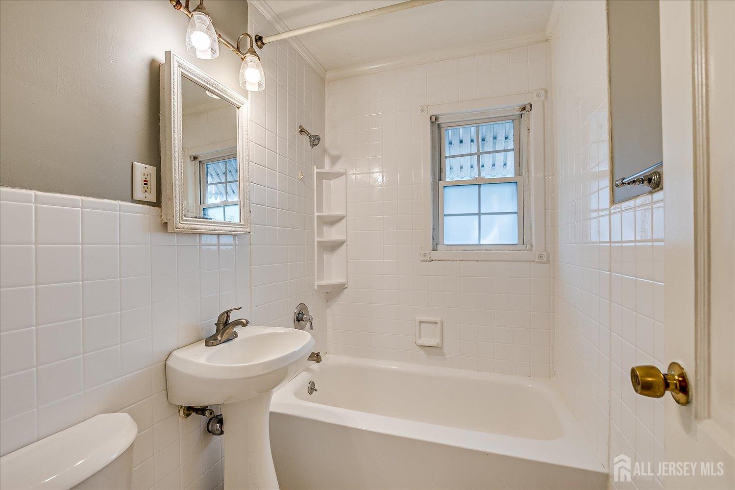 310 Howard Avenue Middlesex, NJ 08846 - Photo 19 of 42 a bathroom with a sink and toilet