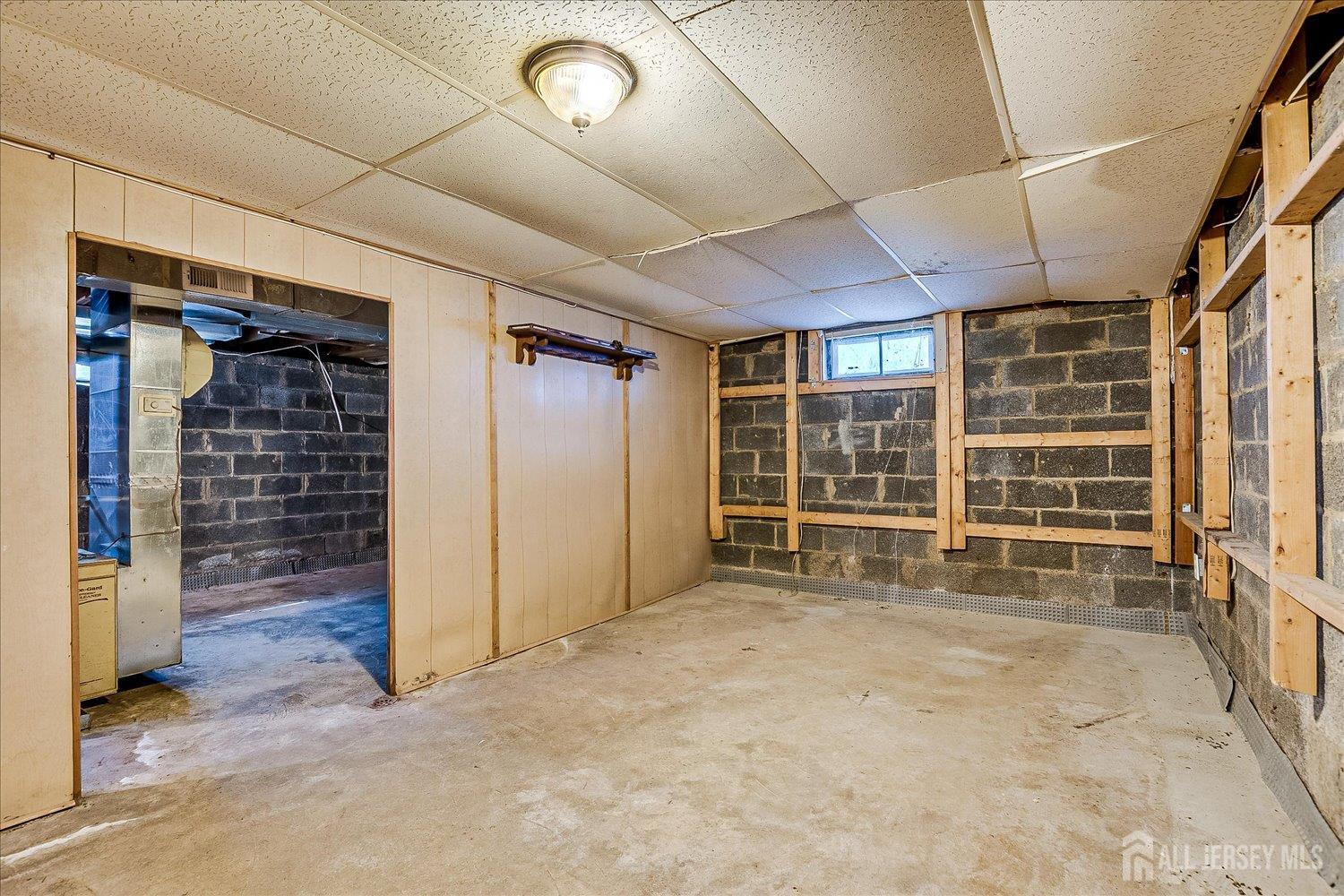 310 Howard Avenue Middlesex, NJ 08846 - Photo 23 of 42 an empty room with wooden floor and windows