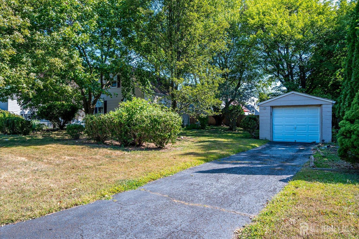310 Howard Avenue Middlesex, NJ 08846 - Photo 28 of 42 a view of backyard with swimming pool and seating space