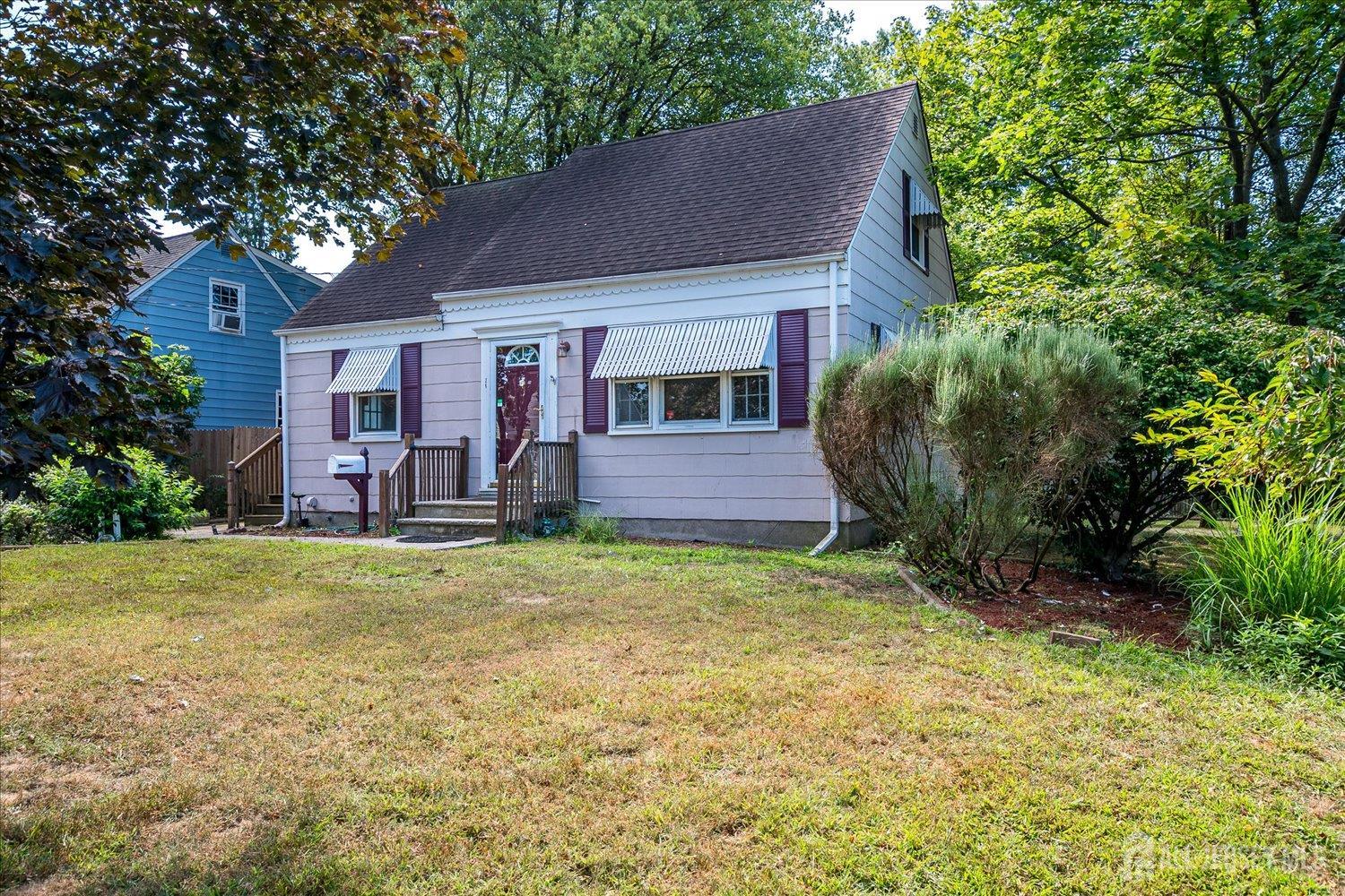 310 Howard Avenue Middlesex, NJ 08846 - Photo 3 of 42 a front view of a house with garden