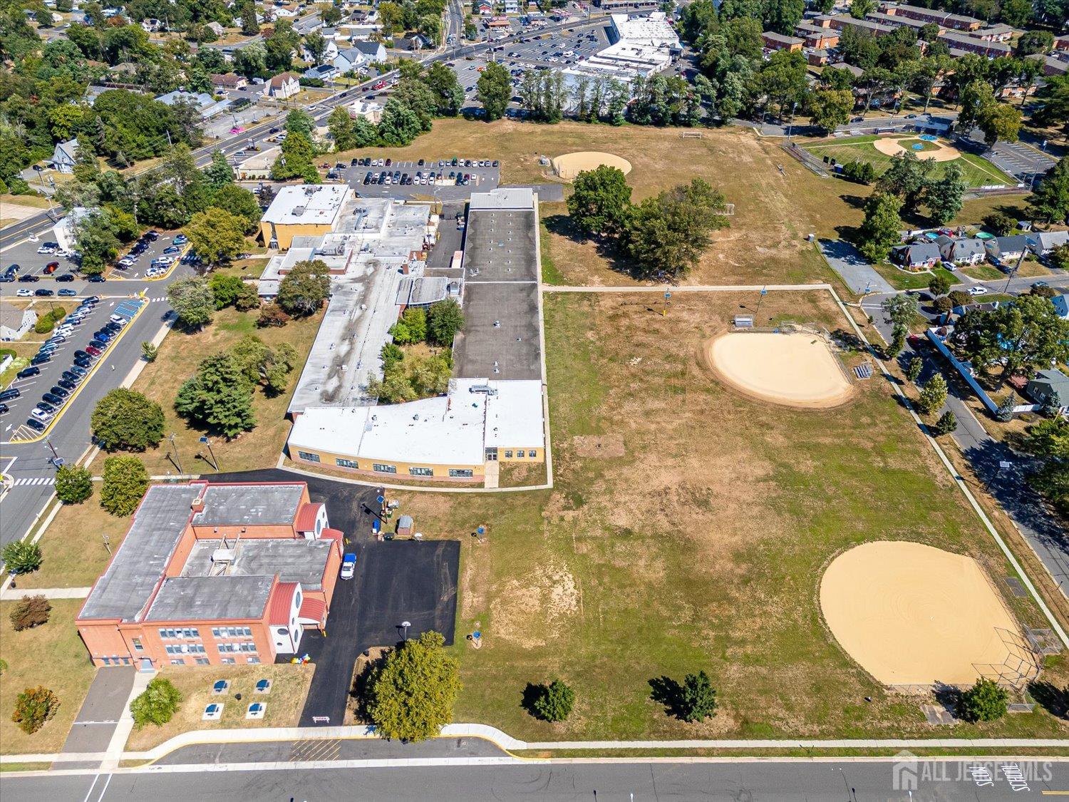 310 Howard Avenue Middlesex, NJ 08846 - Photo 32 of 42 an aerial view of residential houses with outdoor space and parking