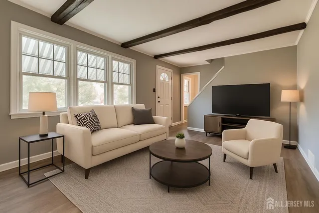 a living room with furniture and a large window