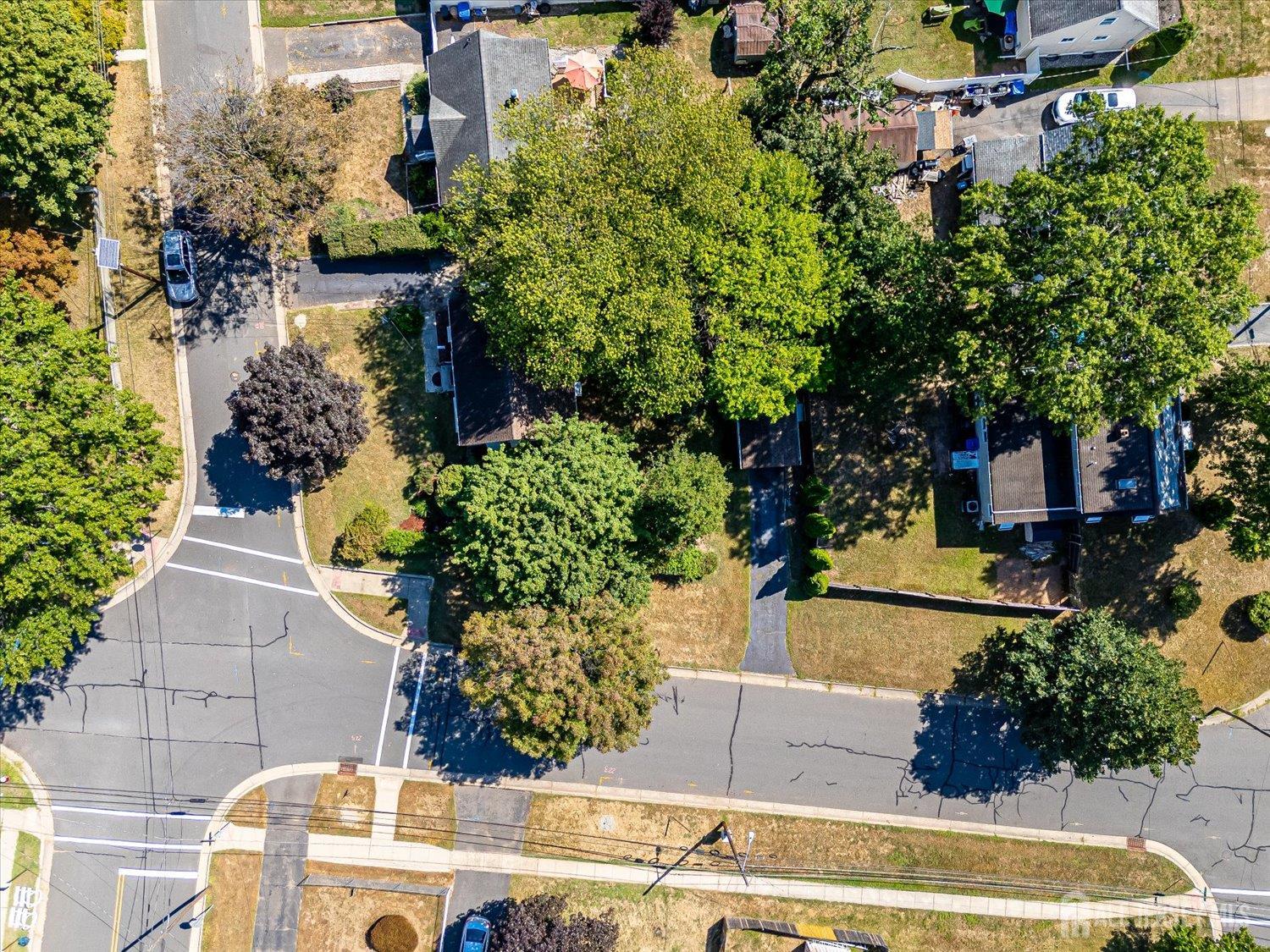 310 Howard Avenue Middlesex, NJ 08846 - Photo 6 of 42 an aerial view of a house with a yard and garden