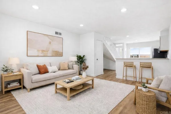 a living room with furniture and a table