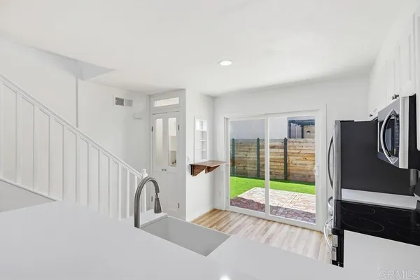 a view of a hallway with workspace