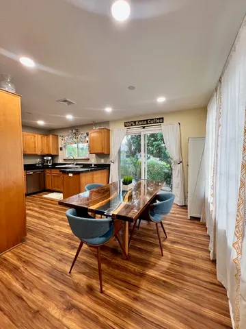 a bathroom with a blue sink and a mirror