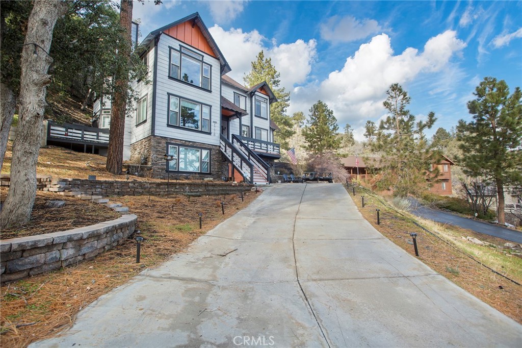 1778 Ash Road Wrightwood, CA 92397 - Photo 1 of 1 a view of a brick building next to a yard
