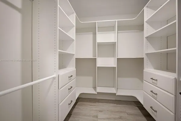 a view of an empty walk in closet