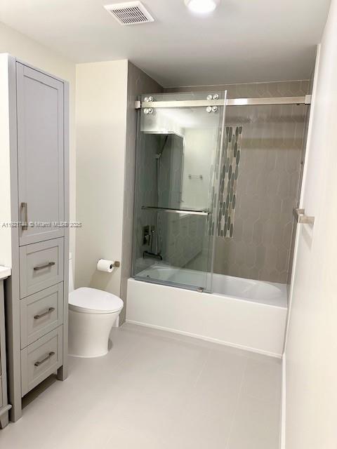 1420 Ocean Way, Unit 19D Jupiter, FL 33477 - Photo 31 of 34 a bathroom with a granite countertop sink toilet and shower