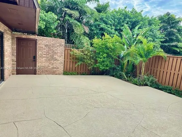 a view of backyard with green space