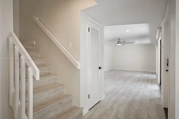 a view of entryway with wooden floor