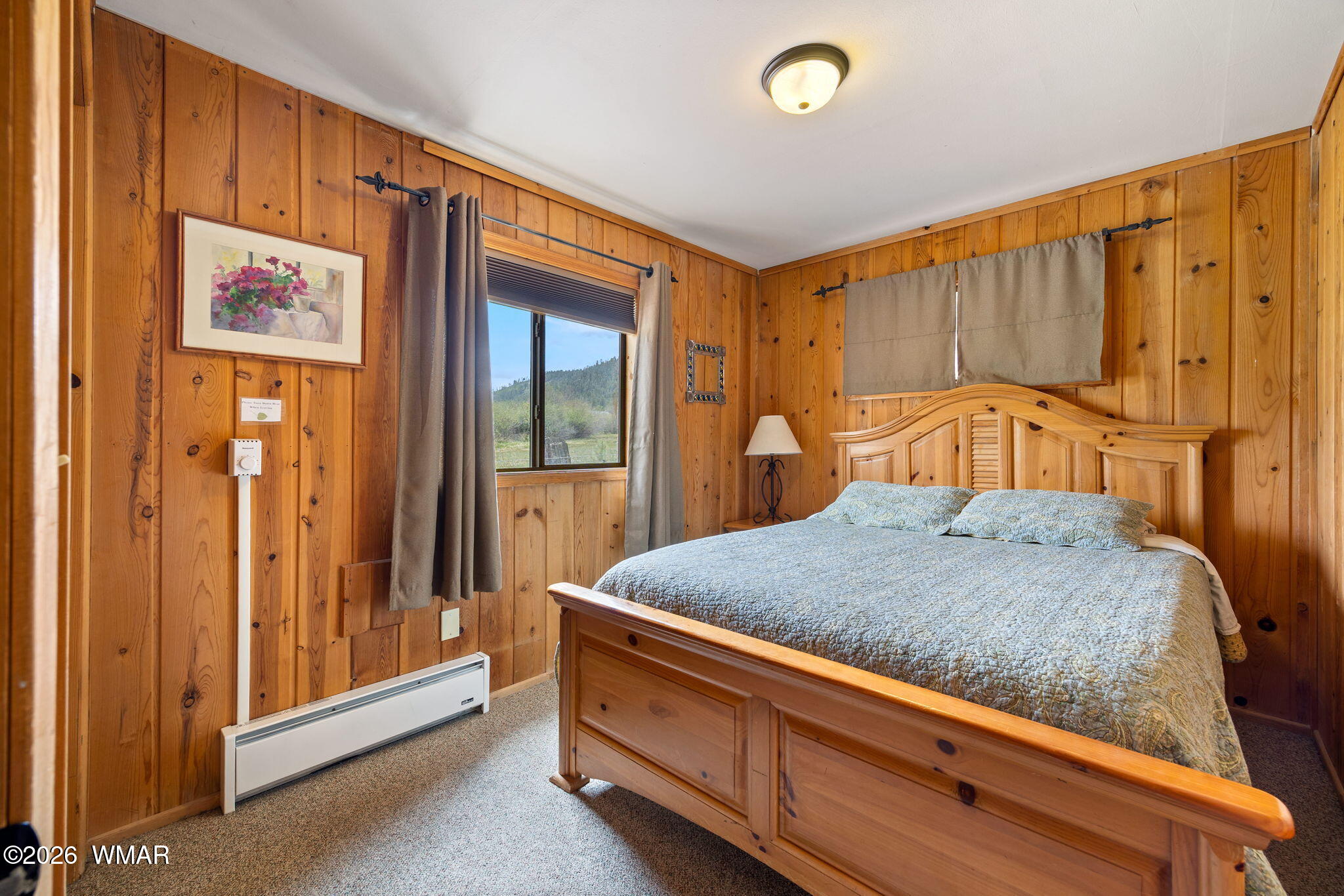85 Main Street Greer, AZ 85927 - Photo 21 of 55 a bedroom with a bed and a dresser