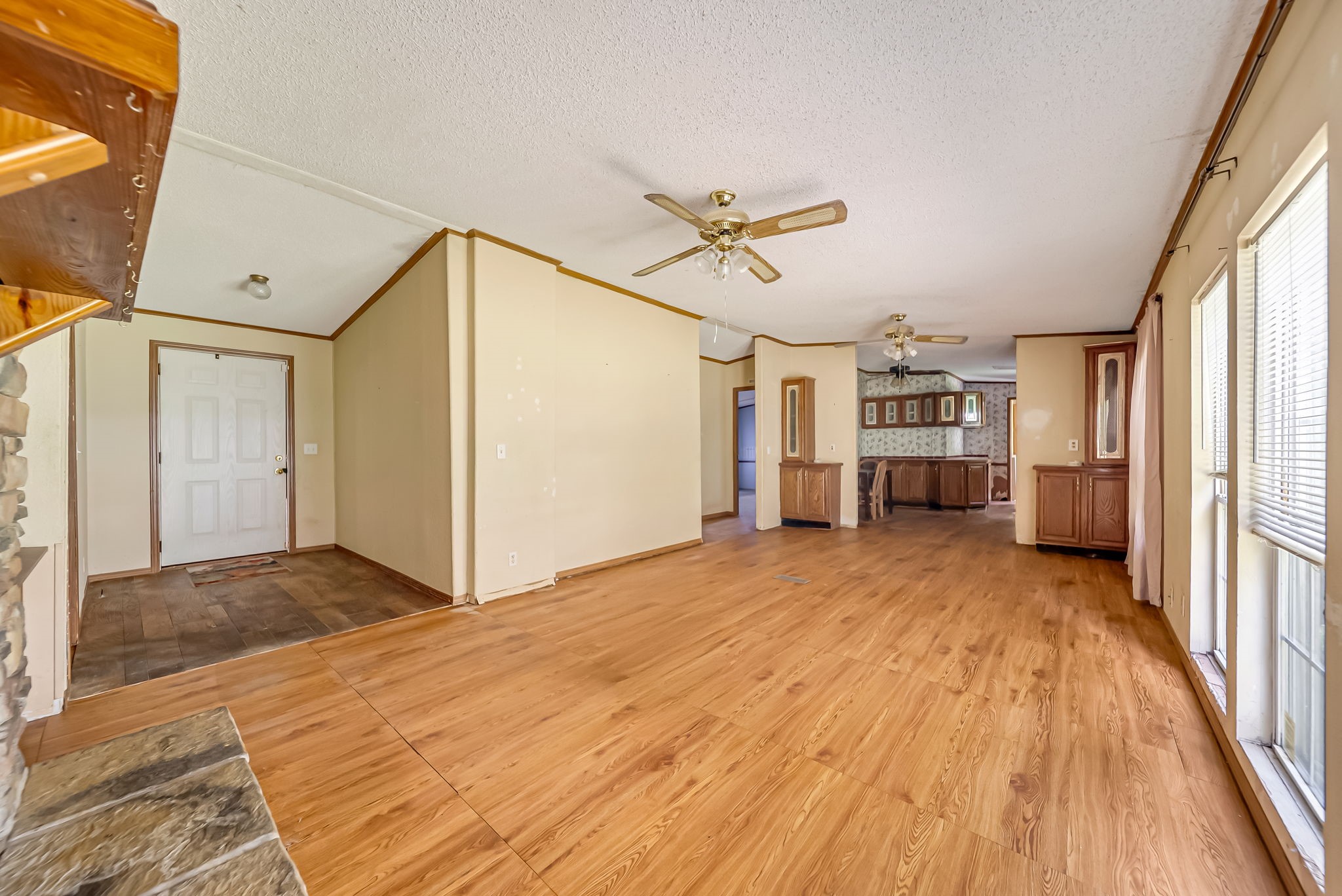 25979 Shade Tree Lane Splendora, TX 77372 - Photo 11 of 22 The spacious open-concept living area offers a flexible layout with abundant natural light, creating the perfect space to gather, entertain, or personalize to your style.