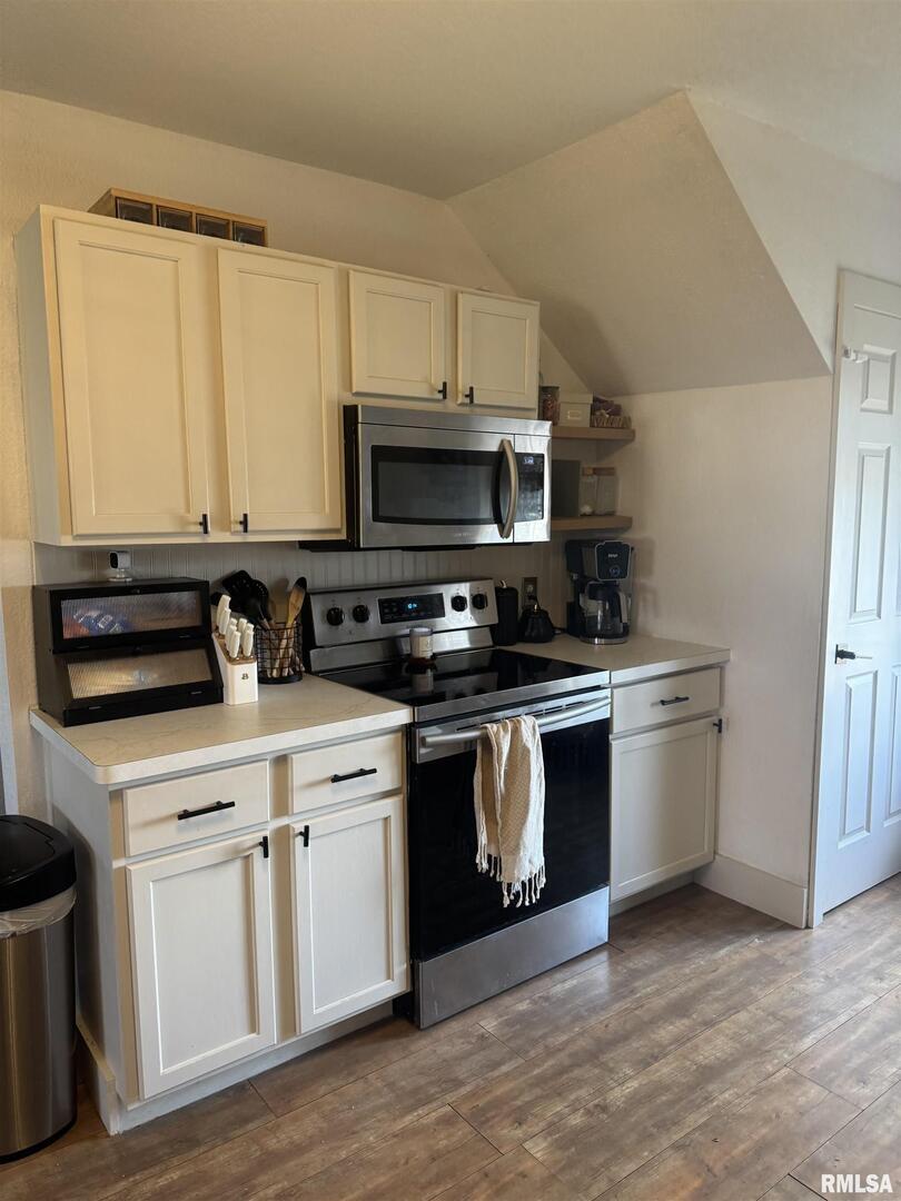 16379 Sand Road Fulton, IL 61252 - Photo 2 of 27 a kitchen with a sink and a stove top oven