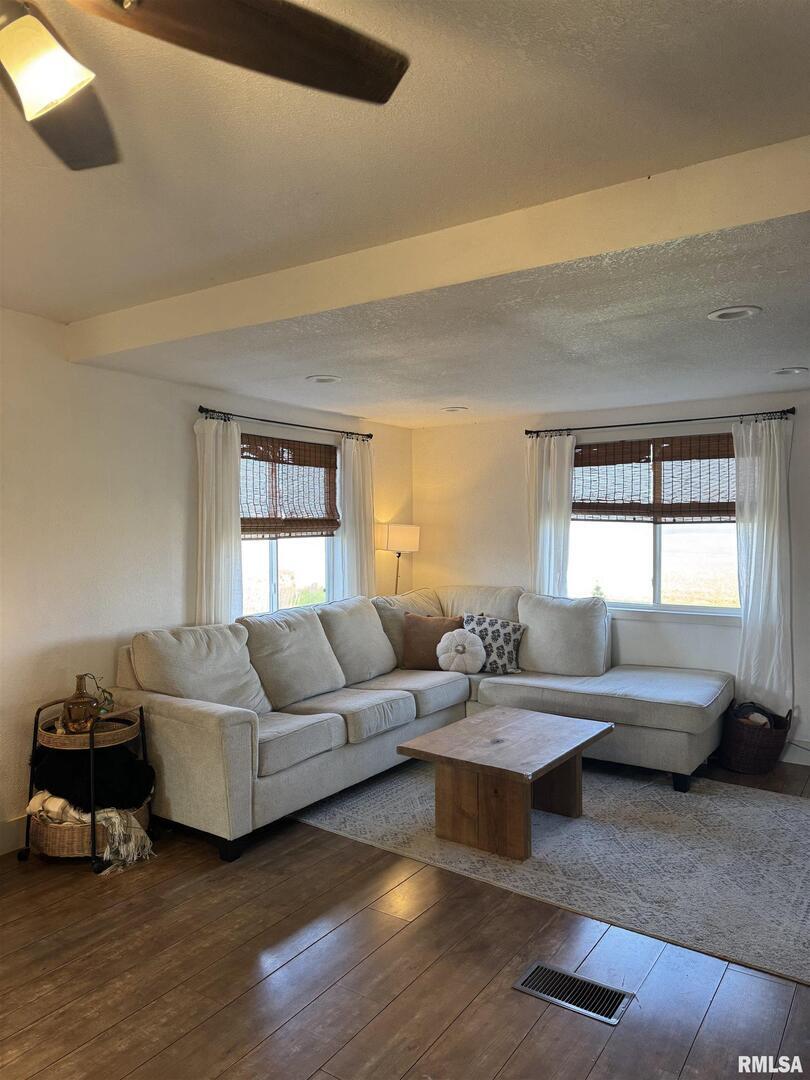 16379 Sand Road Fulton, IL 61252 - Photo 4 of 27 a living room with furniture and a large window