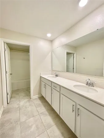 a white toilet sitting next to a bath tub and a shower