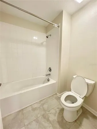 a view of a backyard with plants and a garden