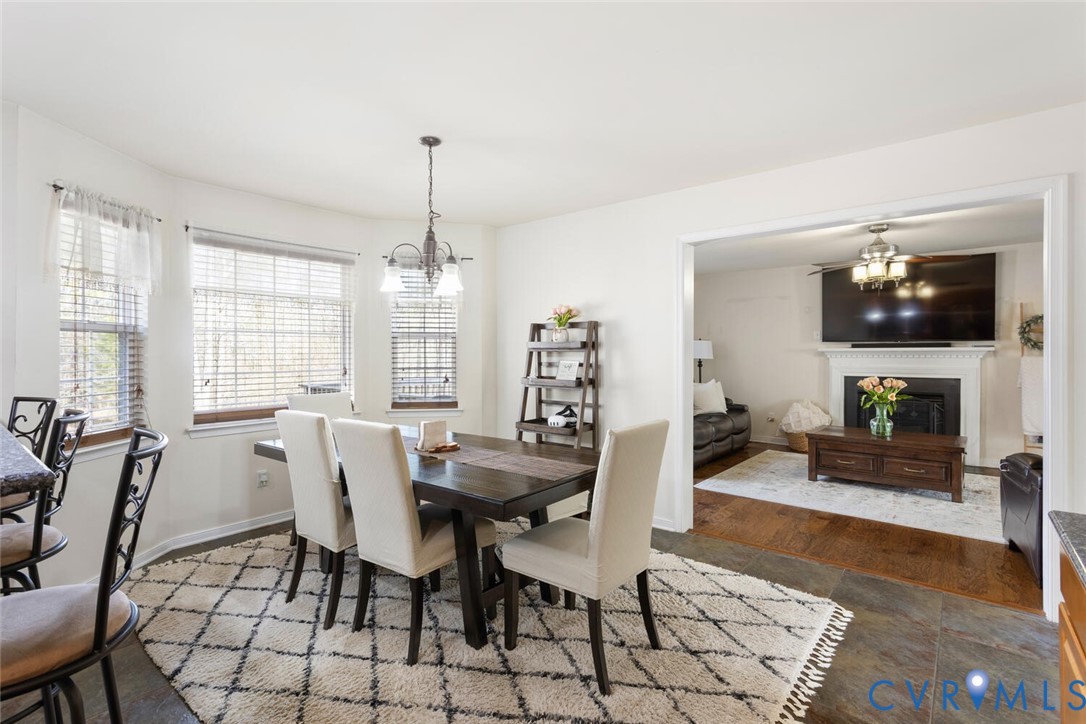 15650 River Road Chesterfield, VA 23838 - Photo 13 of 50 a view of a dining room with furniture window and wooden floor