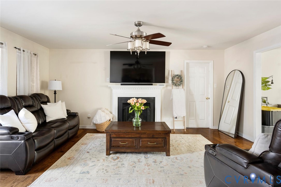 15650 River Road Chesterfield, VA 23838 - Photo 14 of 50 a living room with furniture a flat screen tv and a fireplace