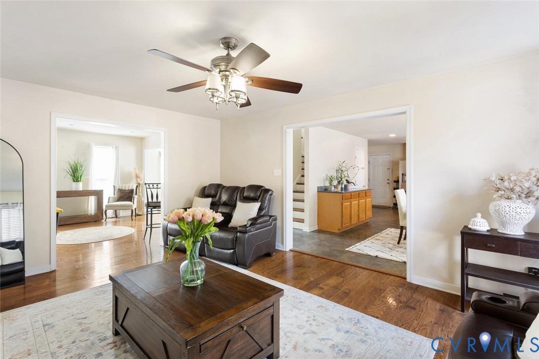 15650 River Road Chesterfield, VA 23838 - Photo 18 of 50 a living room with furniture a rug and a chandelier