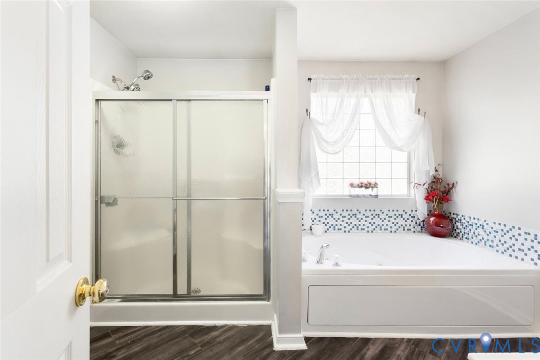 15650 River Road Chesterfield, VA 23838 - Photo 22 of 50 a bathroom with a bathtub and a shower