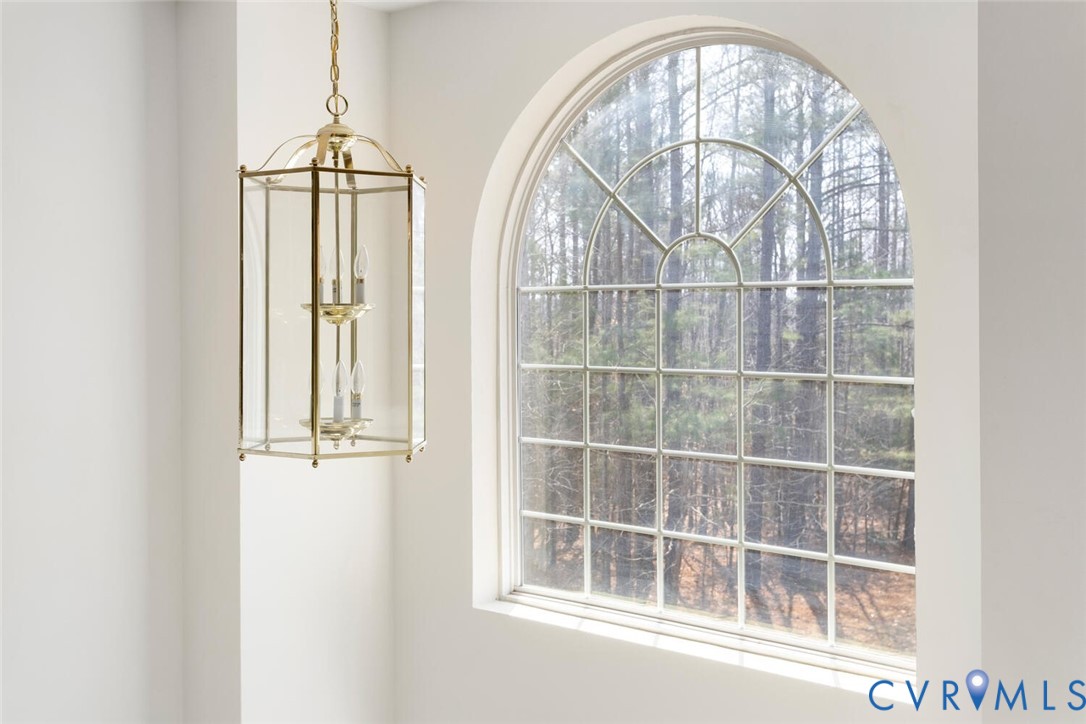 15650 River Road Chesterfield, VA 23838 - Photo 27 of 50 an empty room with wooden floor fan and windows