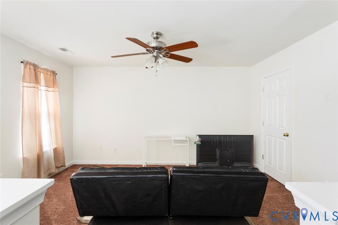 15650 River Road Chesterfield, VA 23838 - Photo 28 of 50 a living room with furniture and a flat screen tv